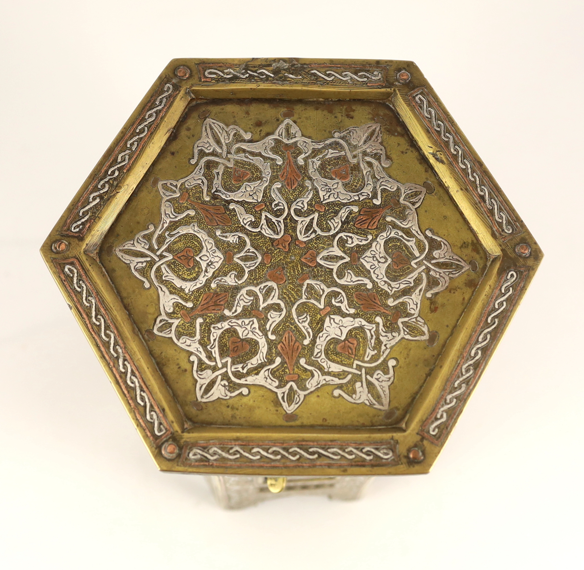 A Cairo ware silver and copper inlaid brass Qur’an stand, early 20th century